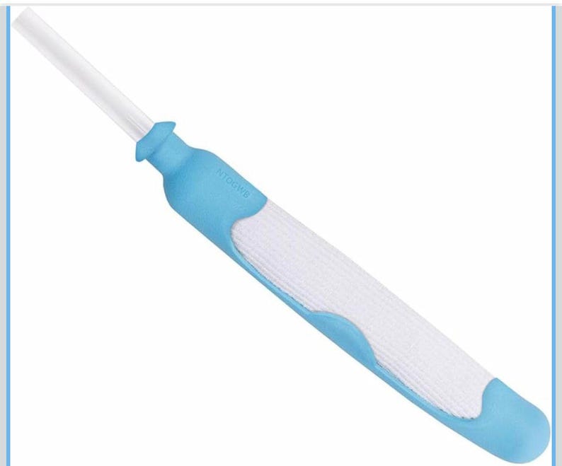 May include: An ear cleaning tool with a long, white, flexible tip. The handle is light blue with a white, textured grip. The tool is designed for ear hygiene.