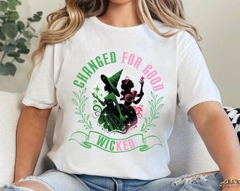 Camiseta floral "Cambiar para bien" con frase musical "Desafía la gravedad" de Broadway 474443