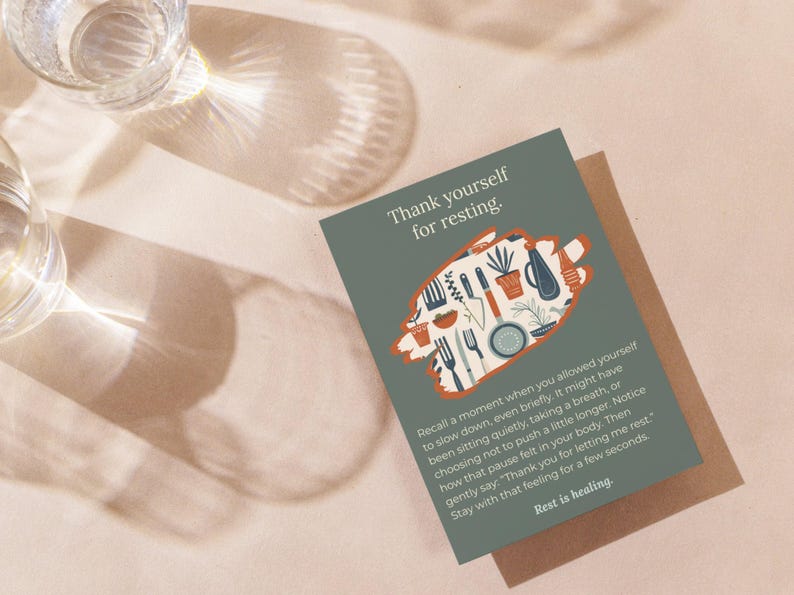 May include: A rectangular greeting card with a sage green background featuring the text Thank yourself for resting. A central orange brushstroke shape contains illustrations of kitchen utensils and plants. The bottom text reads Rest is healing.