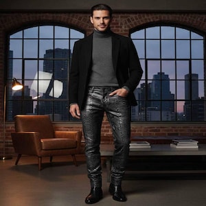May include: A person wearing a black blazer, gray turtleneck sweater, and black snake-skin patterned pants. The person is standing in front of a large window with a city skyline view. The room has a brick wall and a leather chair.