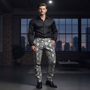 May include: A man wearing a black button-down shirt and snake-print pants. The pants feature a black and white pattern. The man is standing in a room with a brick wall and a large window overlooking a city skyline. He is also wearing black shoes.