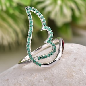 Delicate 925 silver ring with emerald-green CZs forming an angel wing outline, gift for her, great for everyday boho wear.