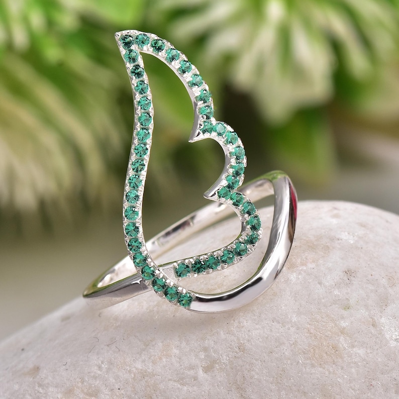 Delicate 925 silver ring with emerald-green CZs forming an angel wing outline, gift for her, great for everyday boho wear.