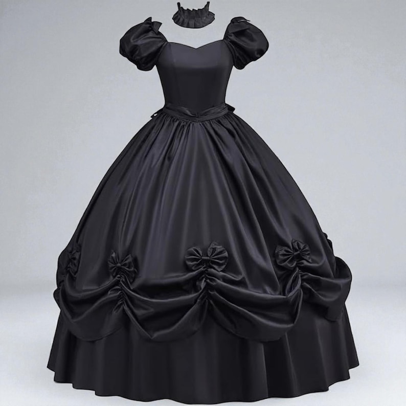 May include: A black ball gown with a sweetheart neckline, short puffed sleeves, and a matching choker. The full skirt features decorative bows and gathered fabric details. The dress is made of a shiny, satin-like material.