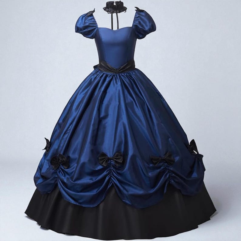 May include: A blue and black ball gown with a satin finish. The dress features a fitted bodice, short puffed sleeves, and a full skirt with black bows. A black choker is included.