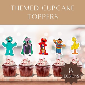 May include: Themed cupcake toppers featuring Sesame Street characters. The image shows six cupcakes with character toppers, including Elmo, Cookie Monster, and Big Bird. The cupcakes have red frosting with white sprinkles. Text at the top reads "THEMED CUPCAKE TOPPERS."