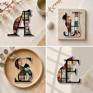 May include: Four decorative letters A, N, S, and E featuring a black cat silhouette integrated into the typography. The letters contain a stained glass pattern with red camellia flowers, pink cherry blossoms, and a grid of muted green and yellow.