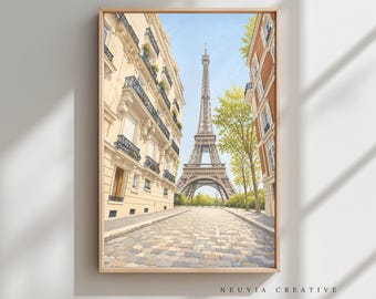 May include: A framed print of a Parisian street scene featuring the Eiffel Tower. The artwork depicts the tower centered between buildings with balconies and a cobblestone street. The sky is blue, and the print is signed "NEUVIA CREATIVE".