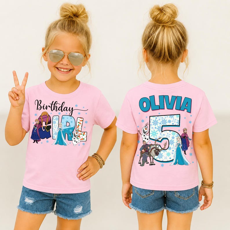 May include: Pink short-sleeved t-shirt with a graphic featuring characters and text from the movie Frozen. The front says "Birthday Girl" and the back says "Olivia 5". The girl is wearing denim shorts.