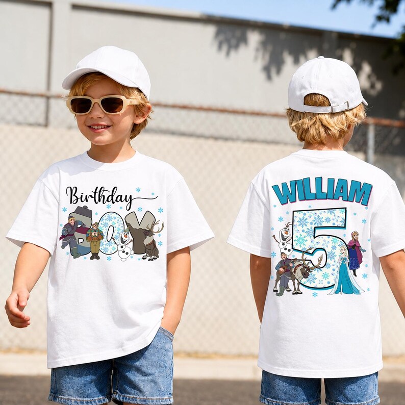 May include: White t-shirt featuring a "Frozen" theme. The front displays "Birthday" and "05" with characters. The back has "WILLIAM" and "5" with characters. The shirt is worn by a child.