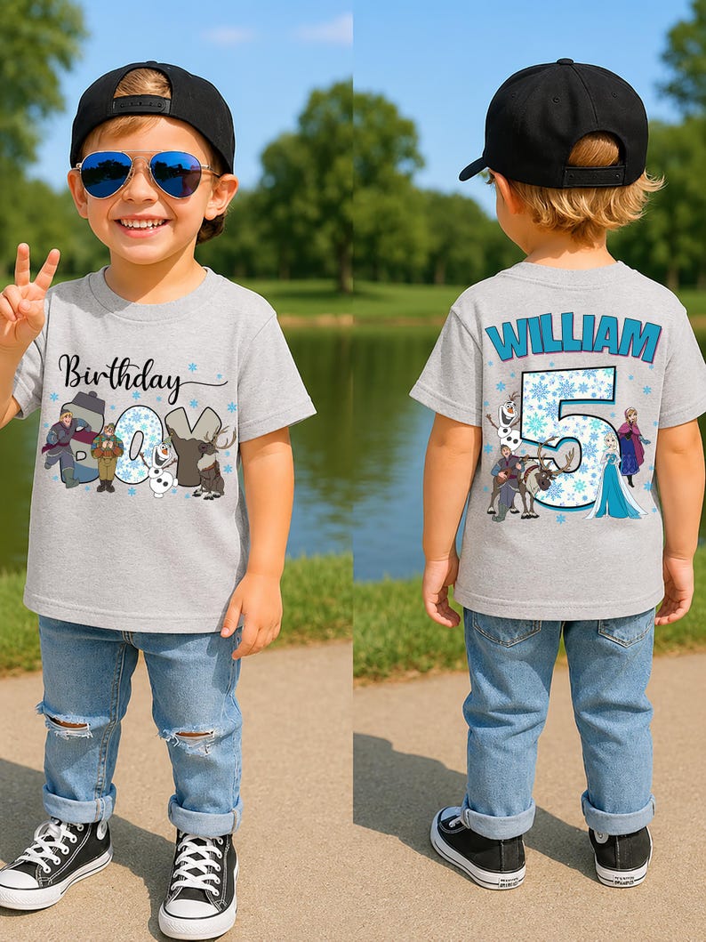 May include: A gray t-shirt with the text "Birthday" and a graphic of characters from the movie Frozen. The number "5" and the name "William" are on the back of the shirt. The child is wearing blue jeans and black sneakers.