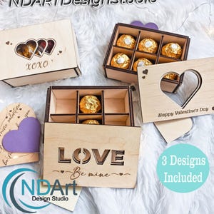 May include: Wooden chocolate box templates with heart-shaped cutouts and the text "XOXO", "LOVE Be mine", and "Happy Valentine's Day". The boxes are filled with gold-wrapped chocolates. The image also includes a purple heart and the text "3 Designs Included".