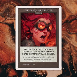 May include: A trading card featuring Chandra, Spark Hunter. The card has a portrait of a woman with fiery red hair and goggles, with glowing orange eyes. Text on the card reads, "Whenever an artifact you control enters, this emblem deals 3 damage to any target."