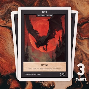 May include: Three trading cards with a bat illustration set against a red moon. The cards have a black border and white text that reads "BAT TOKEN CREATURE" and "FLYING". The quote "Don't look up. Some shadows have teeth." is also included.