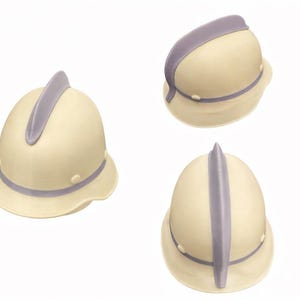 May include: Three cream-colored pith helmets with lavender accents are displayed against a white background. Each helmet has a brim, a central ridge, and a band around the base. The helmets are shown from different angles.