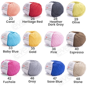 Pode incluir: Doze novelos de fio YarnArt Genius em v&aacute;rias cores, cada um com uma etiqueta de papel branca. As cores incluem coral, vermelho heritage, cinza escuro mesclado, oliva, azul beb&ecirc;, ouro, rosa, espresso, f&uacute;csia, cinza, azul saxe e pedra.