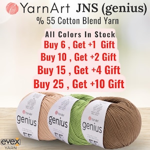 Pode incluir: Tr&ecirc;s novelos de fio YarnArt JNS genius, mistura de 55% algod&atilde;o, nas cores bege claro, verde claro e castanho. Cada novelo tem uma etiqueta de papel branco com o nome da marca e detalhes do produto. A imagem inclui texto sobre promo&ccedil;&otilde;es.