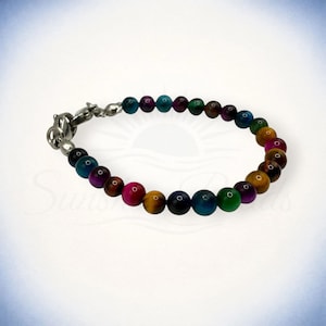 May include: A set of three ceramic mugs with a speckled, matte finish in cream, light grey, and dark grey. Each mug has a simple, minimalist design, suitable for coffee or tea.