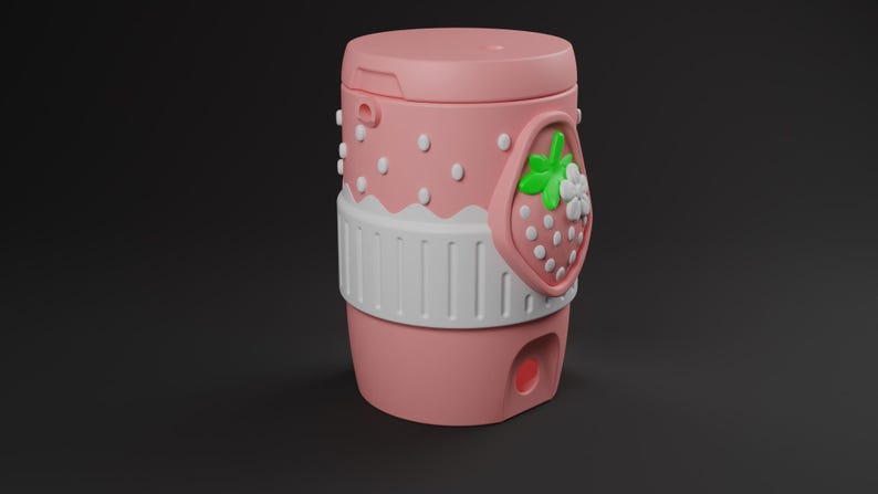 May include: A cylindrical pink container featuring a white scalloped band around the middle and a raised strawberry emblem with green leaves and white flowers. The upper section has small white dots, and a small circular opening is visible at the base.