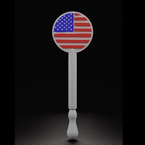May include: A white bottle stopper with a circular top displaying the American flag. The flag design includes red and white stripes and a blue field with white stars. The stopper has a long, slender handle.