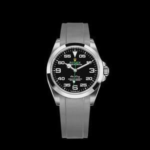 May include: A silver-toned wristwatch with a black face and a gray band. The watch face displays the brand name "ROLEX" and the words "Air King". The watch has a black bezel and a gray band. The hands are silver and green.