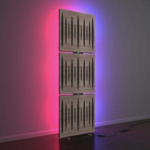 May include: A vertical wooden panel structure composed of three rectangular sections. Each section features a series of vertical black lines. The structure is illuminated with pink and purple ambient lighting, creating a modern aesthetic. The panels are supported by a wooden base.