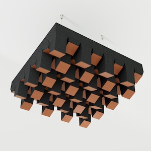 May include: Acoustic ceiling panel with a geometric design. The panel is dark grey with a textured surface and features numerous recessed, angled wooden blocks. The blocks are a warm, natural wood tone, creating a contrast with the dark grey.