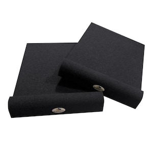 May include: Black acoustic foam panels and rolled sections. The panels are rectangular and have a textured surface. The rolled sections have a circular cross-section. The image shows the product against a white background. The product has a logo on it.