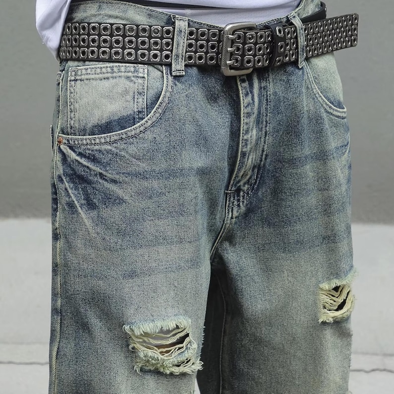 Men's Ripped Denim Jeans | High Waisted Distressed Pants | Streetwear Y2k Vintage Fashion
.
A pair of men's ripped denim jeans with a relaxed, distressed design and streetwear-inspired silhouette. The jeans feature a loose fit, visible rips, and casual styling ideal for Y2K, grunge, or vintage outfits.