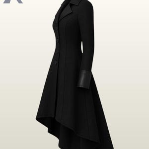 May include: A black, long-sleeved coat with a tailored fit. The coat features a notched collar, button closure, and a flared, asymmetrical hemline. The sleeves have black leather cuffs. The coat is approximately 48 inches long at the longest point.