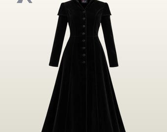May include: A long, black velvet coat with a high collar and button-down front. The coat has long sleeves and a flared skirt, creating an elegant silhouette. The coat is a solid black color.