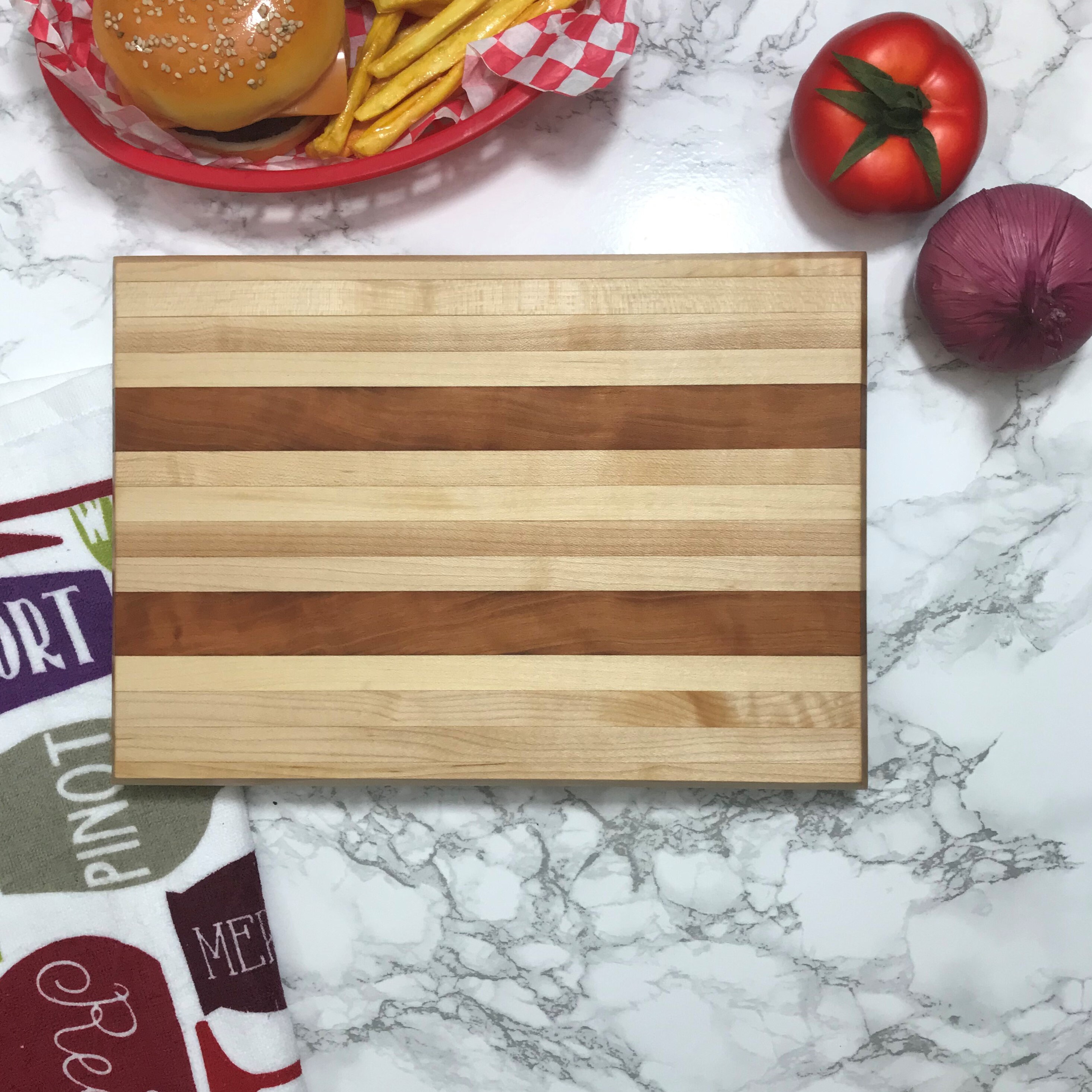 Maple and Cherry thick cutting board. Hand made and made to be used