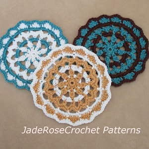 May include: Three crocheted doilies in white, brown, and teal with a repeating pattern of flowers. The doilies are arranged in a triangular shape on a brown surface. The text "JadeRoseCrochet Patterns" is visible at the bottom of the image.