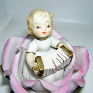 Adorable Lefton Hand Painted Porcelain Accordion Playing Child in Pink Rose