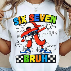 May include: White t-shirt featuring the words "SIX SEVEN" in a rainbow font above a red number seven character wearing sunglasses and a cap. The word "BRUH" is below the character.