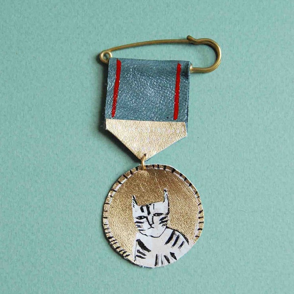 Hand painted leather medal brooch