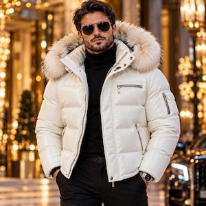 May include: A white puffer jacket with a large fur-trimmed hood, featuring a high collar, horizontal quilted panels, and multiple zippered pockets on the chest and sleeve. The jacket is worn over a black turtleneck sweater and black trousers.