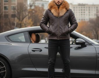 May include: A brown leather jacket with a fur collar, paired with black jeans and brown boots. The jacket has a crocodile skin texture. A gray sports car is in the background.