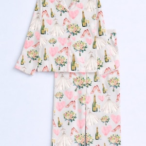 May include: A set of three ceramic mugs with a speckled, matte finish. Each mug features a different color: light blue, cream, and gray. The mugs have a simple, modern design and a comfortable handle.