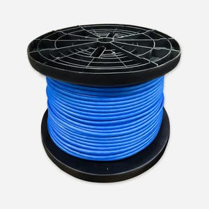 May include: A spool of bright blue cable, tightly wound, sits between two black plastic discs. The top disc has a grid-like pattern. The cable is a vibrant, solid blue color, suggesting it's new and unused. The overall presentation is clean and professional.