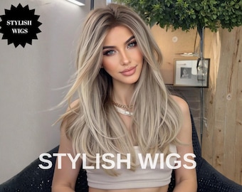 May include: A woman with long, layered blonde and light brown hair. The image features the text "STYLISH WIGS" in large white letters at the bottom and a black starburst with the same text at the top left.