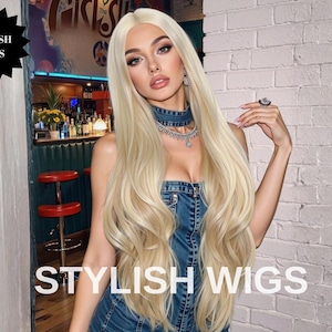 May include: A woman with long, wavy, blonde hair, wearing a denim dress and jewellery. The image includes the text "STYLISH WIGS" at the bottom and a logo that says "STYLISH WIGS" in a black starburst shape.