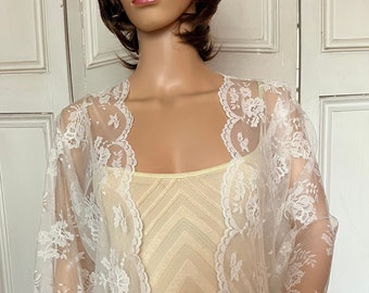 Ivory lace three-quarter length sleeved bolero/shrug/jacket