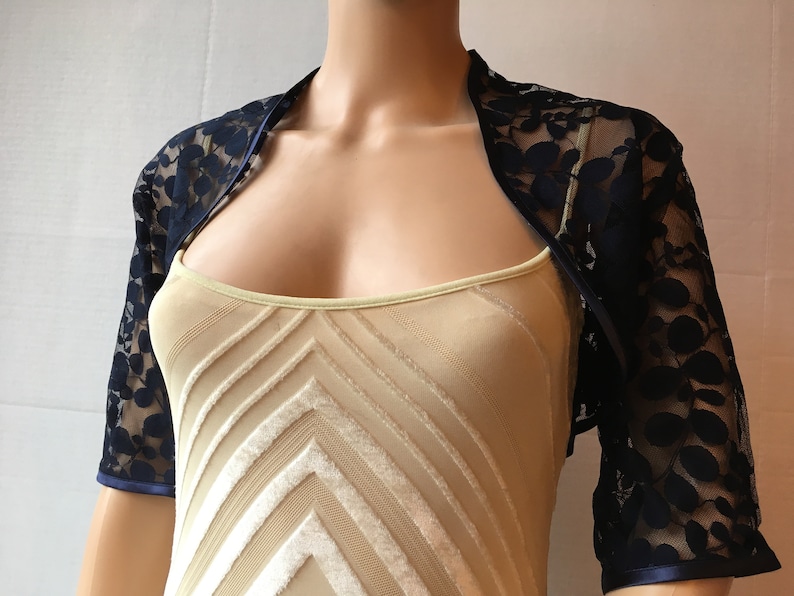 Dark bluenavy leaf design lace elbow length sleeved boleroshrugjacket with satin edging