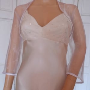 White organza three quarter length sleeved bolero/shrug/jacket  with satin edging
