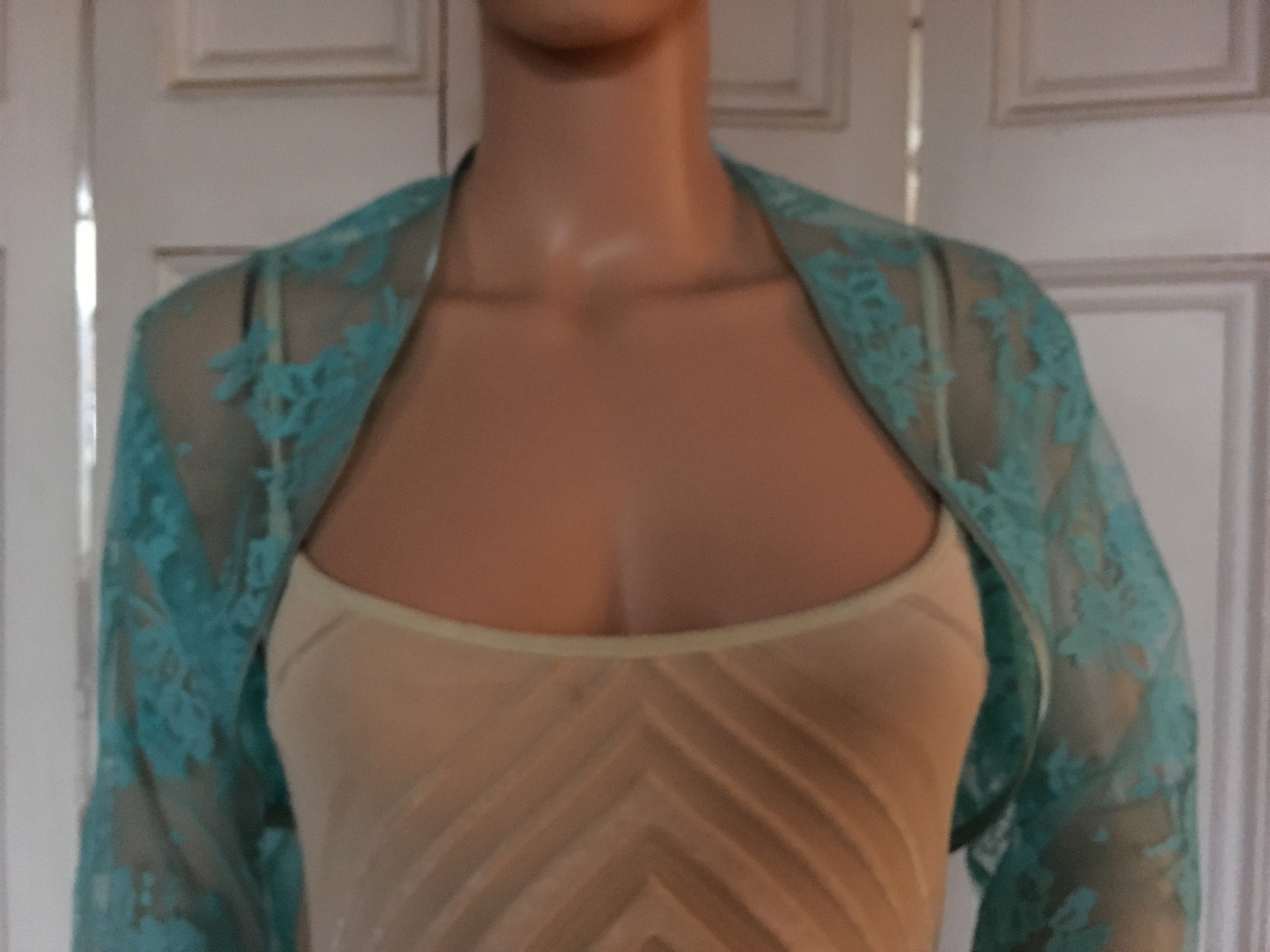 Turquoise lace three-quarter length sleeved bolero/shrug/jacket  with satin edging