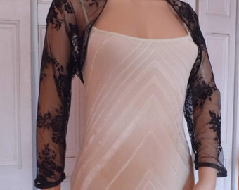 Black lace three-quarter length sleeved bolero/shrug/jacket  with satin edging