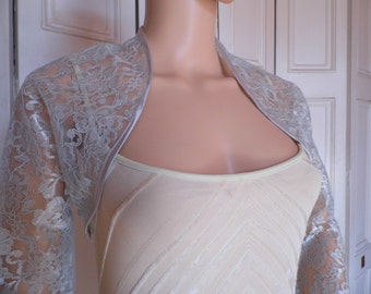 Silver lace three-quarter length sleeved bolero/shrug/jacket  with satin edging