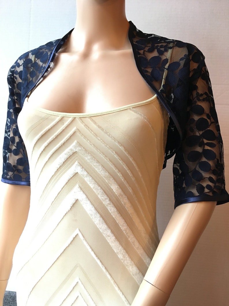 Dark bluenavy leaf design lace elbow length sleeved boleroshrugjacket with satin edging