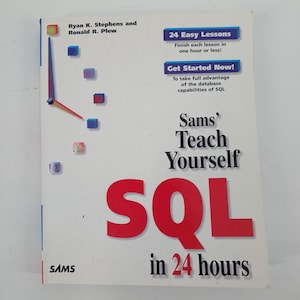 May include: A white instructional book titled Sams' Teach Yourself SQL in 24 hours by Ryan K. Stephens and Ronald R. Plew. The cover features a clock graphic made of small colored cubes, blue text boxes, and large red letters spelling SQL.